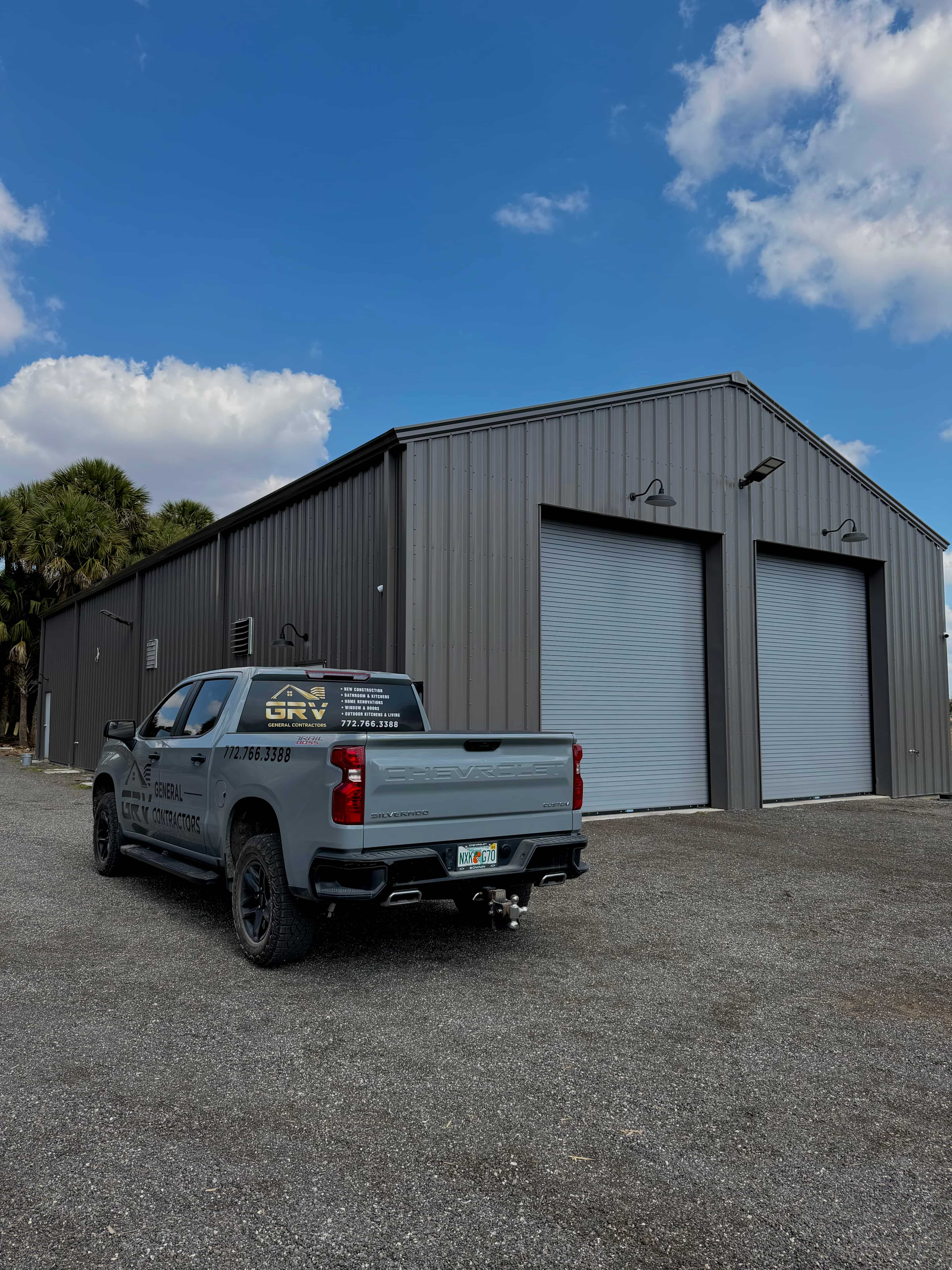 GRV branded truck parked in front of a metal building project site in Vero Beach, FL